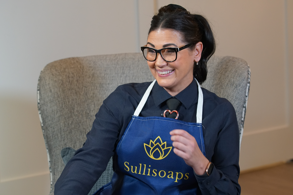 Colleen with Sullisoaps apron in chair